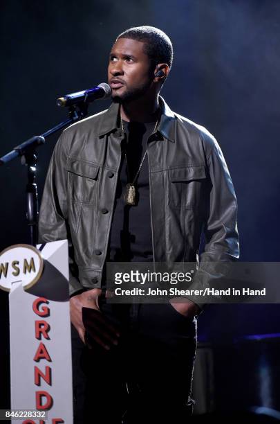 In this handout photo provided by Hand in Hand, Usher performs onstage during Hand in Hand: A Benefit for Hurricane Relief at the Grand Ole Opry...