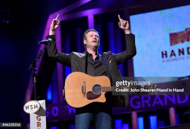 In this handout photo provided by Hand in Hand, Blake Shelton performs onstage during Hand in Hand: A Benefit for Hurricane Relief at the Grand Ole...