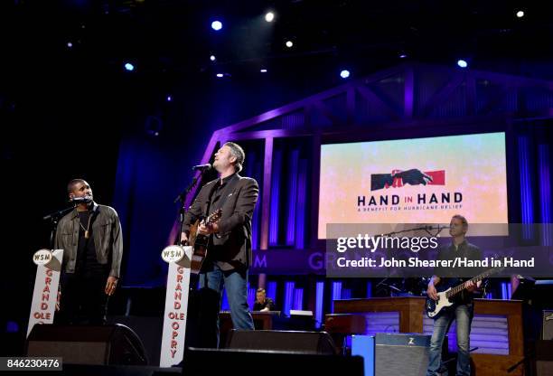 In this handout photo provided by Hand in Hand, Usher and Blake Shelton perform onstage during Hand in Hand: A Benefit for Hurricane Relief at the...