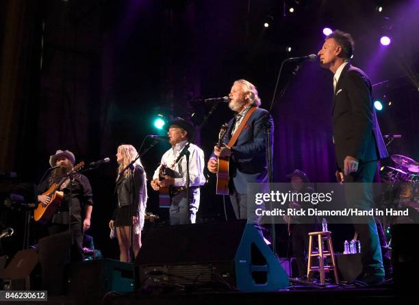 In this handout photo provided by Hand in Hand, Chris Stapleton, Miranda Lambert, George Strait, Lyle Lovett and Robert Early Keen perform onstage...