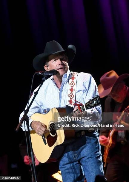 In this handout photo provided by Hand in Hand, George Strait performs onstage during George Strait's Hand in Hand Texas benefit concert; Strait and...
