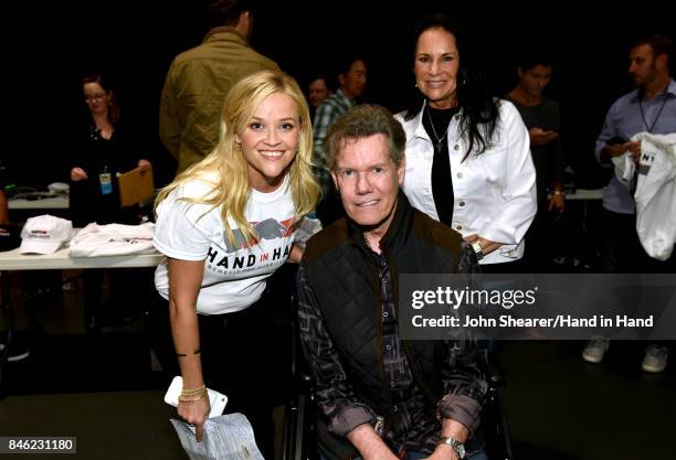 In this handout photo provided by Hand in Hand, Reese Witherspoon and Randy Travis attend Hand in Hand: A Benefit for Hurricane Relief at the Grand...