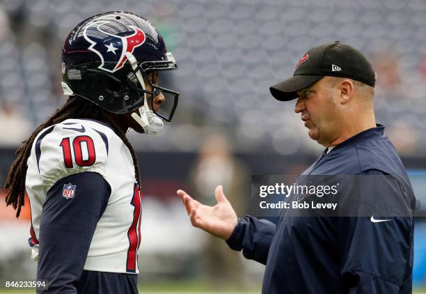 DeAndre Hopkins of the Houston Texans talks with head coach Bill O'Brien of the Houston Texans at NRG Stadium on September 10, 2017 in Houston, Texas.