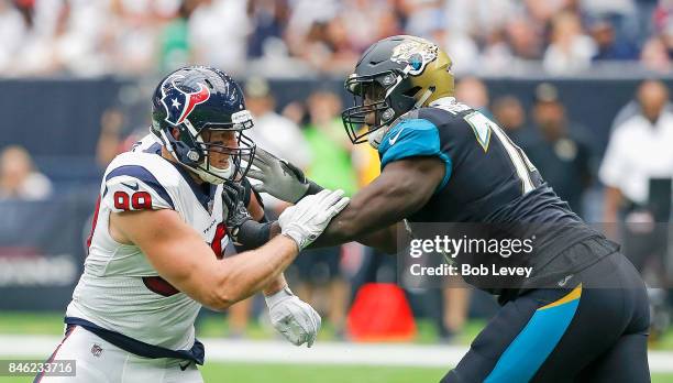 Watt of the Houston Texans and Cam Robinson of the Jacksonville Jaguars battle one on one at NRG Stadium on September 10, 2017 in Houston, Texas.