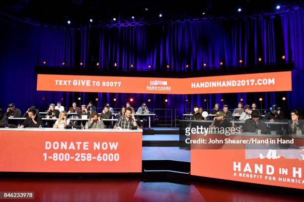 In this handout photo provided by Hand in Hand, A view of the call center during Hand in Hand: A Benefit for Hurricane Relief at the Grand Ole Opry...