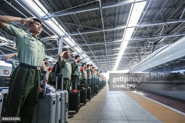 Demobilized armed police officer shares an emotional moment in Ningbo City, east Chinas Zhejiang Province, Sept. 5, 2017. Its time for armed police...