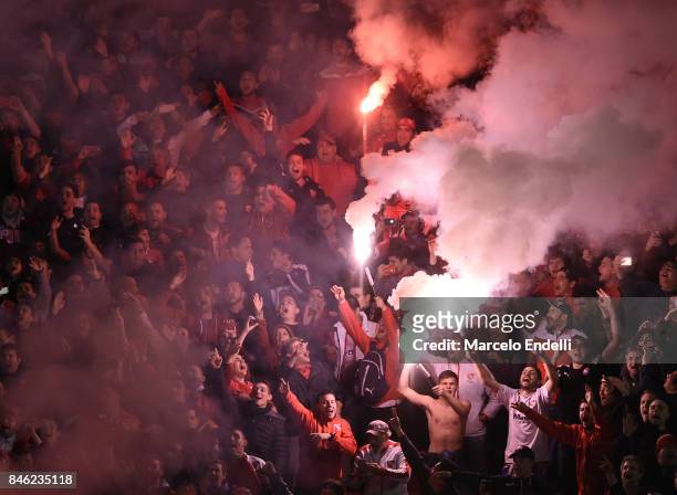 Fans of Independiente cheer for their team during a second leg match between Independiente and Atletico Tucuman as part of round of 16 of Copa...