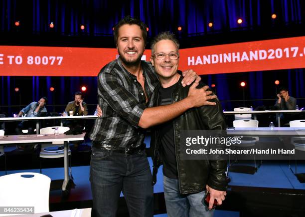 In this handout photo provided by Hand in Hand, Luke Bryan and Robert Deaton attend Hand in Hand: A Benefit for Hurricane Relief at the Grand Ole...