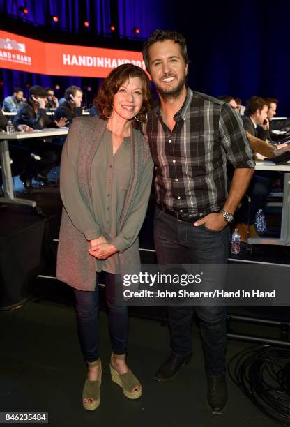 In this handout photo provided by Hand in Hand, Amy Grant and Luke Bryan attend Hand in Hand: A Benefit for Hurricane Relief at the Grand Ole Opry...