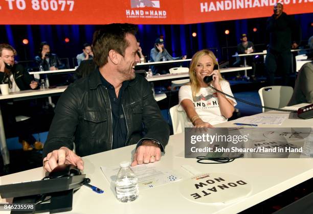 In this handout photo provided by Hand in Hand, Charles Esten and Reese Witherspoon attend Hand in Hand: A Benefit for Hurricane Relief at the Grand...