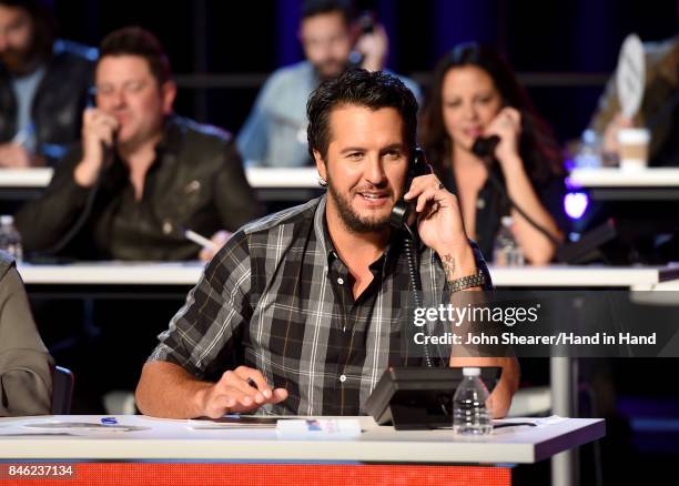 In this handout photo provided by Hand in Hand, Luke Bryan attends Hand in Hand: A Benefit for Hurricane Relief at the Grand Ole Opry House on...