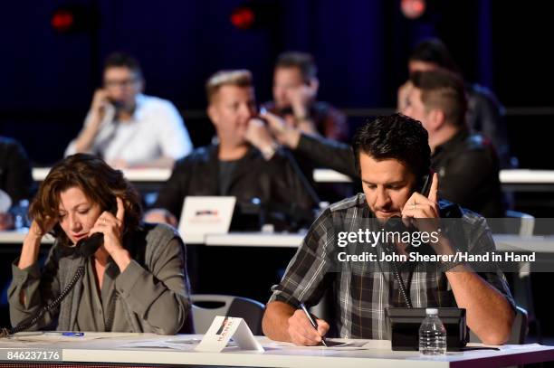 In this handout photo provided by Hand in Hand, Amy Grant and Luke Bryan attend Hand in Hand: A Benefit for Hurricane Relief at the Grand Ole Opry...