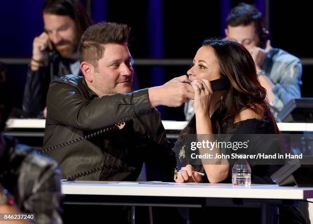 In this handout photo provided by Hand in Hand, Jay DeMarcus and Sara Evans attend Hand in Hand: A Benefit for Hurricane Relief at the Grand Ole Opry...