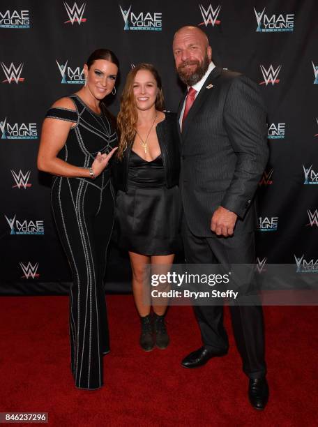 Chief Brand Officer Stephanie McMahon, MMA fighter Ronda Rousey and WWE Executive Vice President of Talent, Live Events and Creative Paul "Triple H"...