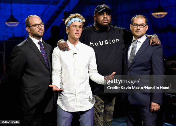 In this handout photo provided by Hand in Hand, Rabbi Ari Lukas, Justin Bieber, Pastor John Gray and Jihad Turk attend Hand in Hand: A Benefit for...