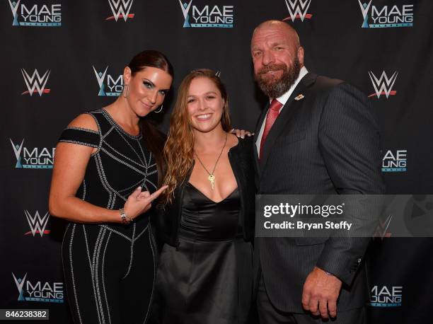 Chief Brand Officer Stephanie McMahon, MMA fighter Ronda Rousey and WWE Executive Vice President of Talent, Live Events and Creative Paul "Triple H"...
