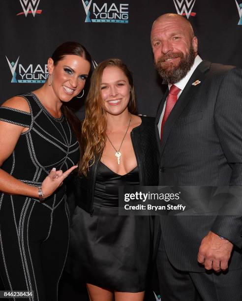 Chief Brand Officer Stephanie McMahon, MMA fighter Ronda Rousey and WWE Executive Vice President of Talent, Live Events and Creative Paul "Triple H"...