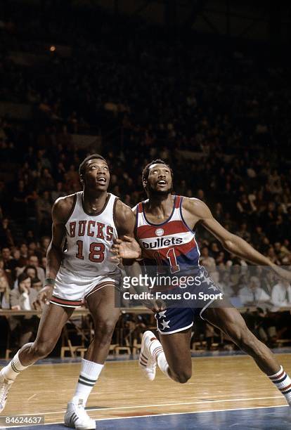 S: Elvin Hayes of the Washington Bullets fights for position under the basket with Curtis Perry of the Milwaukee Bucks during a mid circa 1970's NBA...