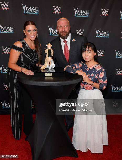 Chief Brand Officer Stephanie McMahon, WWE Executive Vice President of Talent, Live Events and Creative Paul "Triple H" Levesque and fashion designer...