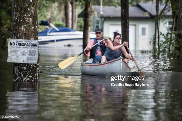 Residents navigate floodwaters caused by Hurricane Irma on September 12, 2017 in Middleburg, Florida, United States. The storm brought flooding to...