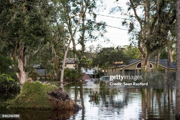 Flood waters from the Black Creek inundate a neighborhood after Hurricane Irma September 12, 2017 in Middleburg, Florida, United States. The storm...