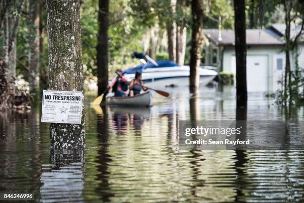 Flood waters from the Black Creek inundate a neighborhood after Hurricane Irma September 12, 2017 in Middleburg, Florida, United States. The storm...