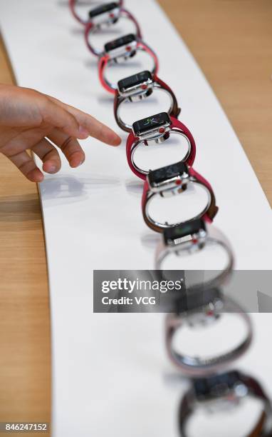 Attendees try out new Apple Watches during the Apple launch event on September 12, 2017 in Cupertino,California. Apple Inc. Unveiled its new iPhone...