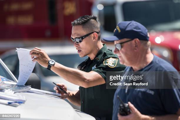 Local law enforcement looks over traffic operations needed after Hurricane Irma September 12, 2017 in Middleburg, Florida, United States. The storm...