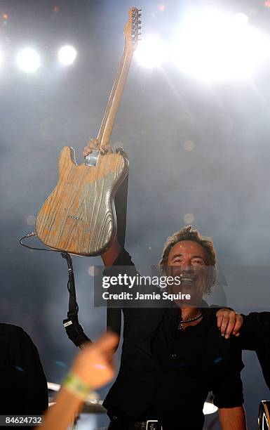 Musician Bruce Springsteen and the E Street Band perform at the Bridgestone halftime show during Super Bowl XLIII between the Arizona Cardinals and...