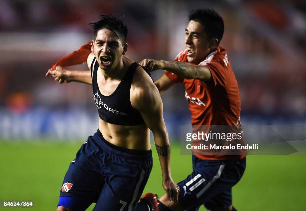 Martin Benitez of Independiente celebrates with teammate Leandro Fernandez after scoring the second goal of his team during a second leg match...
