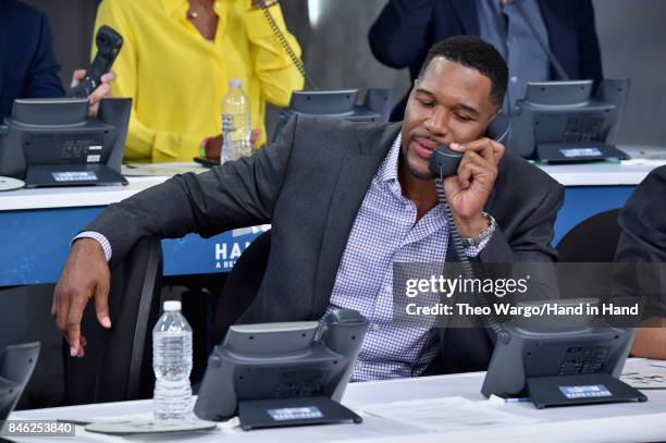 In this handout photo provided by Hand in Hand, Michael Strahan caption at ABC News' Good Morning America Times Square Studio on September 12, 2017...