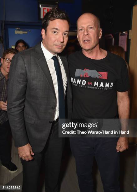 In this handout photo provided by Hand in Hand, Jimmy Fallon and Bruce Willis caption at ABC News' Good Morning America Times Square Studio on...