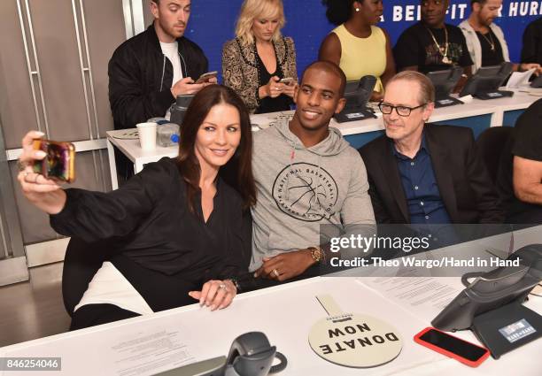 In this handout photo provided by Hand in Hand, Catherine Zeta-Jones, Chris Paul and Ryan Seacrest caption at ABC News' Good Morning America Times...
