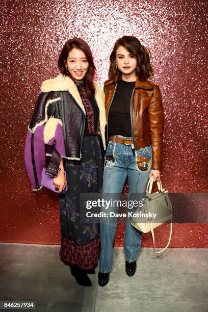 Park Shin-hye and Selena Gomez attend Coach Spring 2019 fashion show during New York Fashion Week at Basketball City - Pier 36 - South Street on...