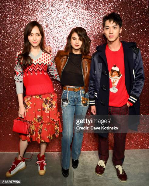 Tiffany Tang, Selena Gomez and Timmy Xu attend Coach Spring 2019 fashion show during New York Fashion Week at Basketball City - Pier 36 - South...