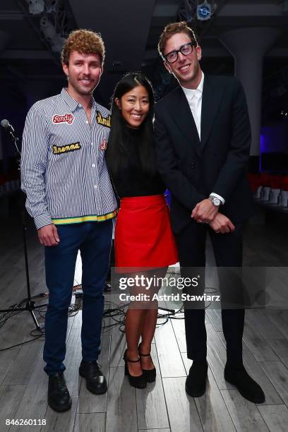 Designers Timo Weiland, Donna Kang and Alan Eckstein pose for photos backstage at Momentum By Timo Weiland during New York Fashion Week at...