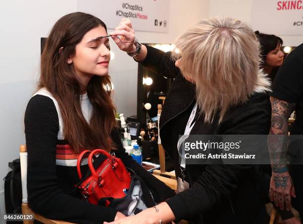 Model prepares backstage at Momentum By Timo Weiland during New York Fashion Week at Metropolitan West on September 12, 2017 in New York City.