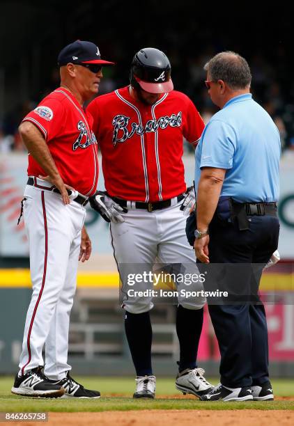 Atlanta Braves outfielder Matt Adams injures his leg during the major league baseball game between the Atlanta Braves and the Miami Marlins on...