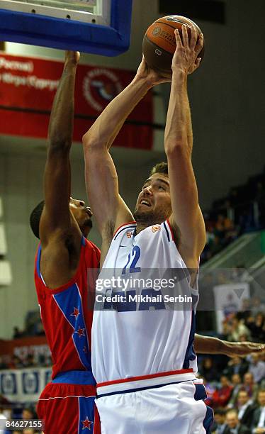 Luksa Andric, #12 of Cibona competes with Terence Morris, #44 of CSKA Moscow in action during the Euroleague Basketball Last 16 Game 2 match between...