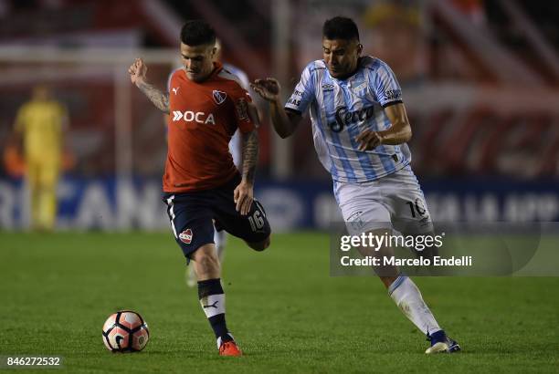 Fabricio Bustos of Independiente fights for ball with Gervasio Nuñez of Atletico Tucuman during a second leg match between Independiente and Atletico...