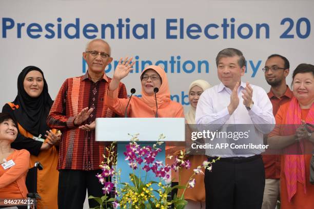 Singapore's new president-elect Halimah Yacob addresses supporters at the nomination centre in Singapore on September 13, 2017. An establishment...