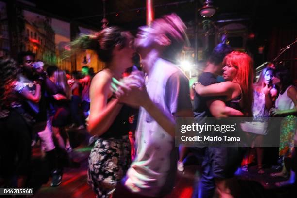 People dance in the famed Gafieira Estudantina, founded in 1928, during forro night on September 13, 2017 in Rio de Janeiro, Brazil. The classic...