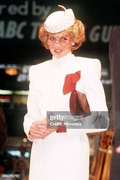 Princess Diana, wearing a white ensemble with red accents, opens the the World Travel Market at Olympia, London, 27th November 1985.
