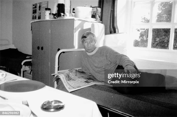 Lester Piggott jockey prison cell Highpoint Open prison lying on bed reading newspaper, 1988.