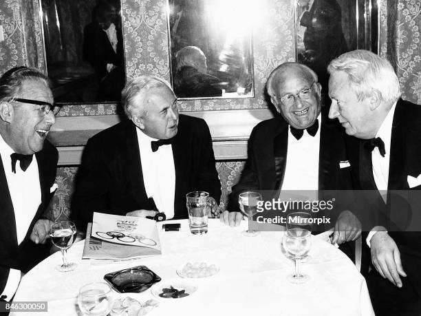 Harold Wilson former Labour Prime Minister of Britain with former Conservative Prime Minister Edward Heath and two unknown guests at a dinner, Circa...