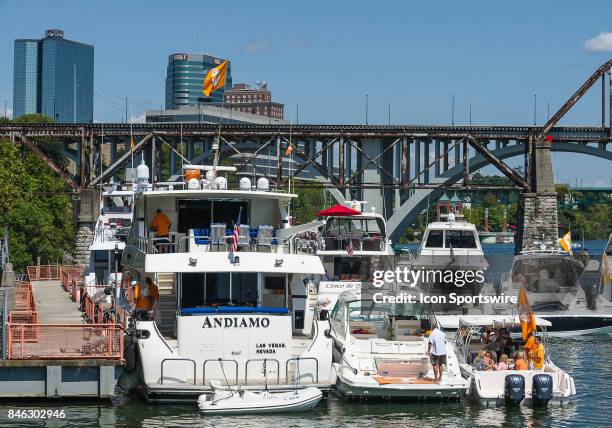 Boats in the Vol Navy on the Tennessee River outside Neyland Stadium with the Knoxville skyline in the background prior to a game between the Indiana...