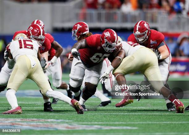 Alabama Crimson Tide offensive lineman Lester Cotton looks to make a block during the Florida State Seminoles vs the Alabama Crimson Tide in the...