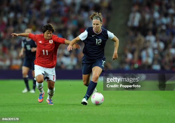 Lauren Cheney of the USA and Shinobu Ohno of Japan in action during the Women's Football gold medal match between Japan and USA on Day 13 of the...