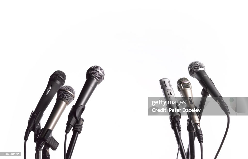 PRESS CONFERENCE MICROPHONES WITH WHITE COPY SPACE