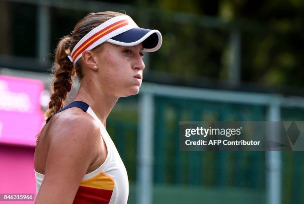 Top seed Kristina Mladenovic of France reacts after losing a point against Jena Fett of Croatia during their first round match of the Japan Women's...